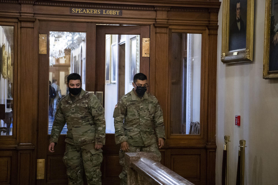 Members of the National Guard are seen in the Speakers Lobby at the door where Ashli Babbitt was killed during the Capitol riot on Jan. 6. (Photo: Tom Williams via Getty Images)