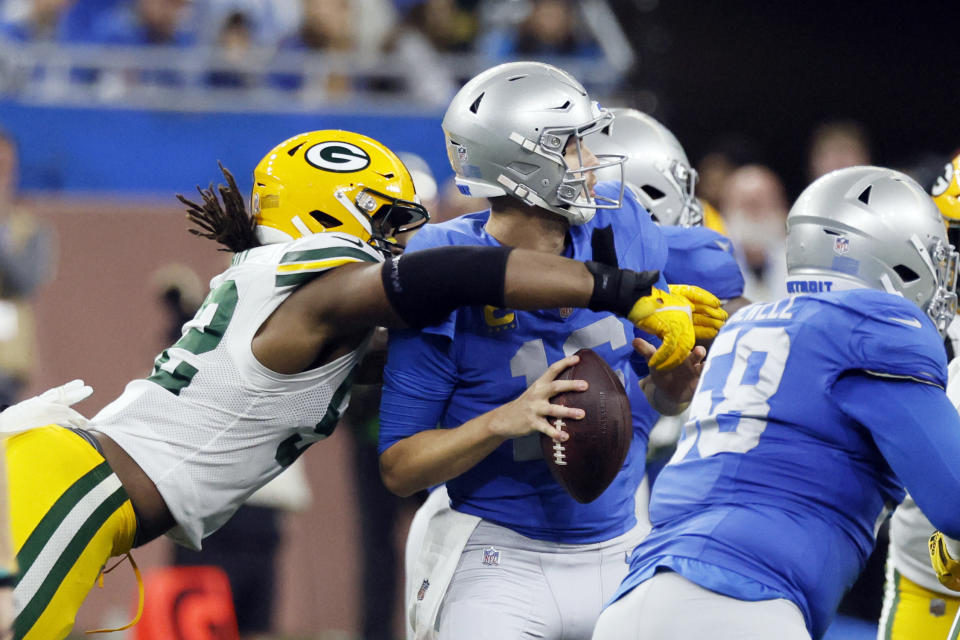 Green Bay Packers linebacker Rashan Gary (52) strips the ball from Detroit Lions quarterback Jared Goff during the second half of an NFL football game, Thursday, Nov. 23, 2023, in Detroit. (AP Photo/Duane Burleson)
