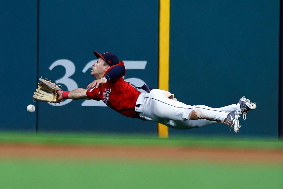 Guardians left fielder Steven Kwan makes a diving attempt on an RBI double by Boston Red Sox outfielder Alex Verdugo in the seventh inning of Friday night's game. The Red Sox won 6-3. [Ron Schwane/Associated Press]