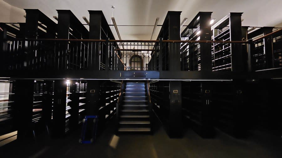 The stacks at the former Moline Public Library downtown are one of several settings for the new immersive theater piece.