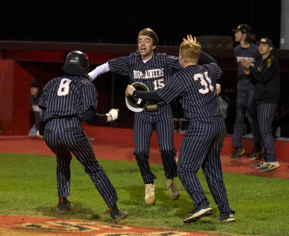 Kings Mountain's Zane Brockman celebrates after his team scored the tying run in the April 8, 2022 game between the Mountaineers and South Point.