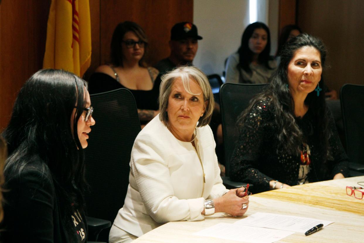 New Mexico Gov. Michelle Lujan Grisham, center, announced an executive order aimed at ensuring safe harbor to people seeking abortions or providing abortions at health care facilities within the state, at a news conference in Santa Fe, N.M., on Monday, June 27, 2022.