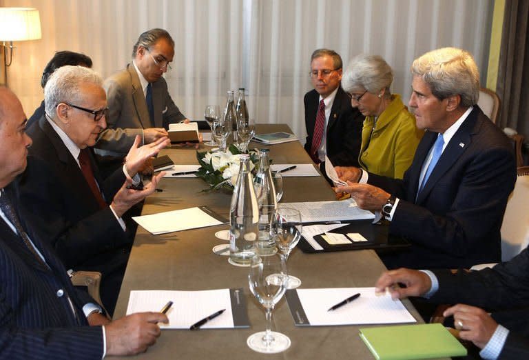 US Secretary of State John Kerry (R) meets with UN Special Representative for Syria Lakhdar Brahimi (2nd L) in Geneva on September 12, 2013