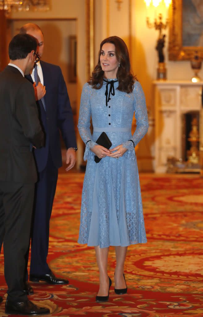 <p>The Duchess made her first public appearance at a Buckingham Palace reception since announcing <a href="https://www.townandcountrymag.com/society/tradition/a12167619/kate-middleton-due-date-2018/" rel="nofollow noopener" target="_blank" data-ylk="slk:her third pregnancy;elm:context_link;itc:0;sec:content-canvas" class="link ">her third pregnancy</a>. Though Duchess Kate is still <a href="https://www.townandcountrymag.com/society/tradition/a12185279/kate-middleton-hyperemesis-gravidarum-morning-sickness-meaning/" rel="nofollow noopener" target="_blank" data-ylk="slk:suffering from Hyperemesis Gravidarum;elm:context_link;itc:0;sec:content-canvas" class="link ">suffering from Hyperemesis Gravidarum</a>, her light blue, Temperley dress set a cheery tone over her new <a href="https://www.townandcountrymag.com/society/tradition/a12810469/kate-middleton-baby-bump-photos/" rel="nofollow noopener" target="_blank" data-ylk="slk:baby bump;elm:context_link;itc:0;sec:content-canvas" class="link ">baby bump</a>. The knee-length, lace ensemble had black detailing in its front buttons and bowtie neckline, to which Kate matched a black clutch, black pumps, and a pair of blue topaz and diamond earrings by Kiki McDonough.</p>