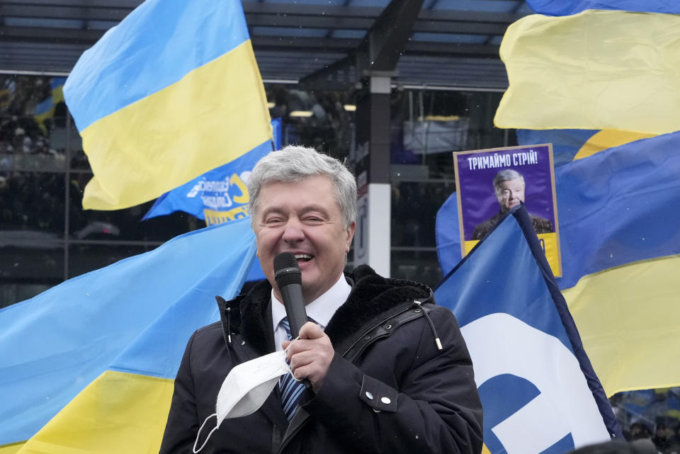 FILE Former Ukrainian President Petro Poroshenko smiles while speaking to his supporters upon his arrival at Zhuliany International Airport outside Kyiv, Ukraine, Monday, Jan. 17, 2022. As a political novice running to be Ukraine’s president, Volodymyr Zelenskyy vowed to reach out to Russia-backed rebels in the east who were fighting Ukrainian forces and make strides toward resolving the conflict. The assurances contributed to his landslide victory in 2019. (AP Photo/Efrem Lukatsky, File)