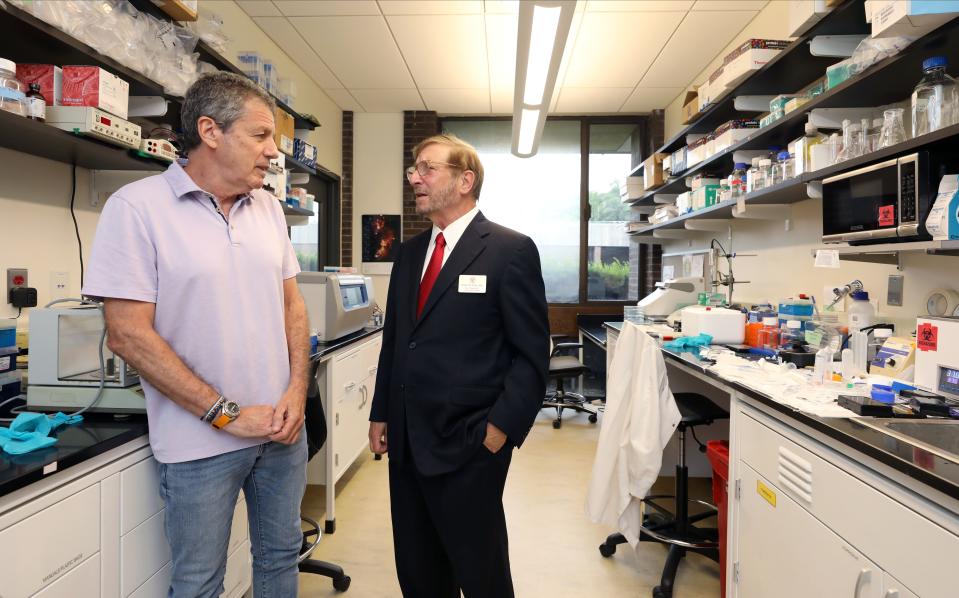 Robert Amler, M.D., the Vice President for Governmental Affairs and the Dean of the School of Health Sciences and Practice at New York Medical College in Valhalla, right, chats with Yaron Hadari, PhD., CEO of SHY Therapeutics in a lab at the incubator at the college, Aug. 21, 2023. Shy has been there since 2015, working on anti-cancer therapies.