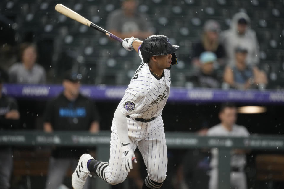 Colorado Rockies' Ezequiel Tovar watches his single off Miami Marlins relief pitcher Huascar Brazoban that drove in the winning run in the ninth inning of a baseball game Thursday, May 25, 2023, in Denver. (AP Photo/David Zalubowski)