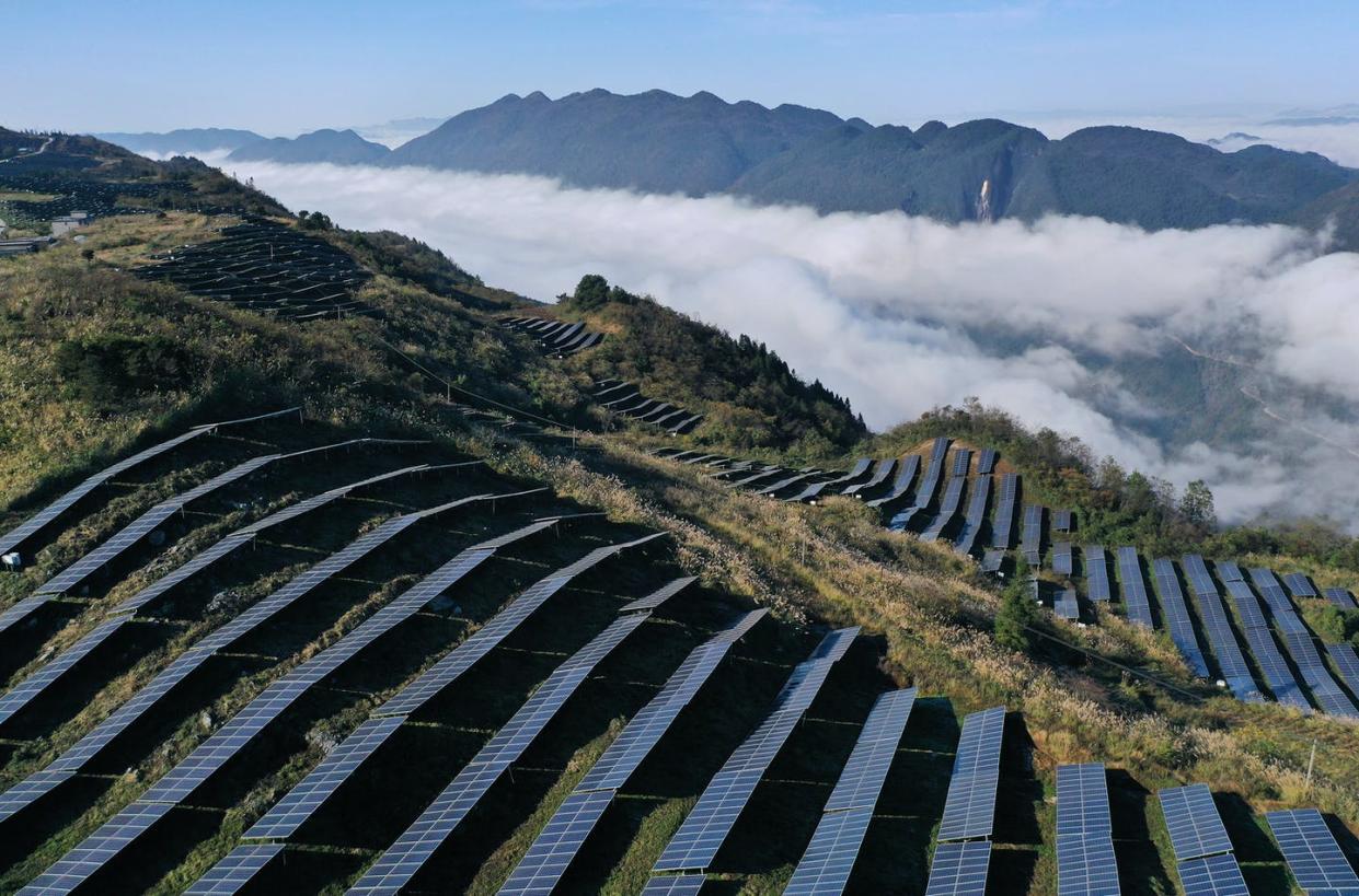 <span class="caption">China has more solar power capacity than any other country and makes many of the world's solar cells, but coal is still its top energy source.</span> <span class="attribution"><a class="link " href="https://www.gettyimages.com/detail/news-photo/clouds-cover-more-than-300-000-photovoltaic-panels-news-photo/1236507119" rel="nofollow noopener" target="_blank" data-ylk="slk:Yang Min/Costfoto/Barcroft Media via Getty Images;elm:context_link;itc:0;sec:content-canvas">Yang Min/Costfoto/Barcroft Media via Getty Images</a></span>
