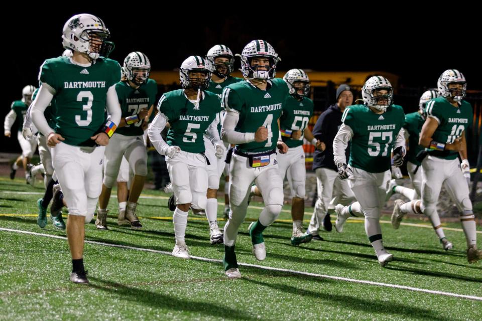 Led by Will Kelly (4), Dartmouth takes the field for its contest with Plymouth North last fall.