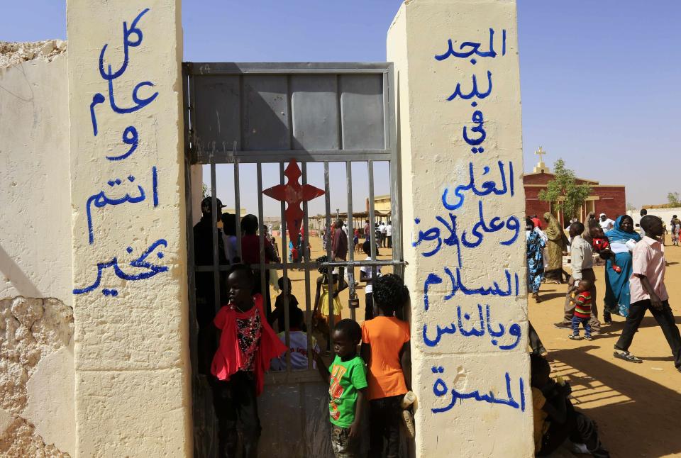 South Sudanese Christians living in the North gather to attend Christmas day celebrations at a Catholic church in Omdurman