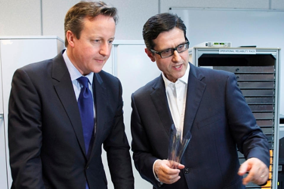 Indro Mukerjee (above with David Cameron) is stepping down as the chief executive of Watchstone: PR Newswire