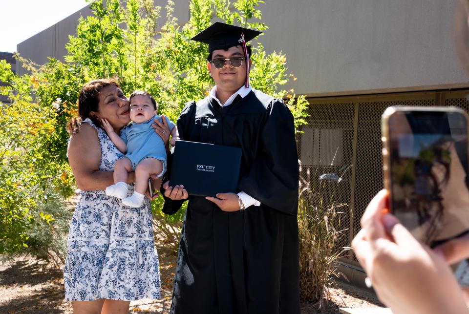 Ali Gonzalez, right, started missing school and working more to help support his family during the pandemic.