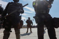 <p>Police block a road during a rally by the Patriot Prayer group in Portland, Ore., Aug. 4, 2018. (Photo: Bob Strong/Reuters) </p>