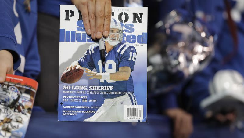 A fan waits for former Indianapolis Colts quarterback Peyton Manning to sign autographs on Nov. 20, 2016, in Indianapolis. The publisher of Sports Illustrated notified employees it was laying off a significant portion — possibly all — of the outlet’s staff after its license to use the iconic brand’s name in print and digital was revoked. In an email to employees on Jan. 19, 2024, the Arena Group, which operates Sports Illustrated and related properties, said that Authentic Brands Group has revoked its marketing license.