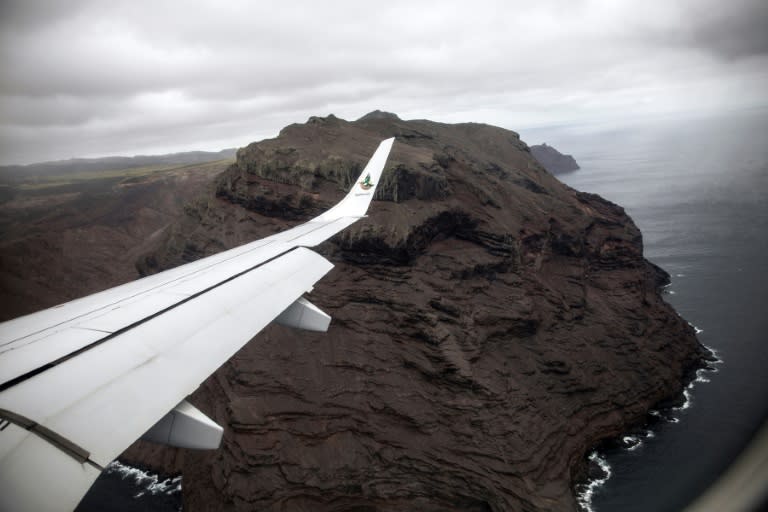 A picture taken from the inaugural first commercial flight between Johannesburg and Saint Helena shows the cliffs of the volcanic tropical island in the South Atlantic