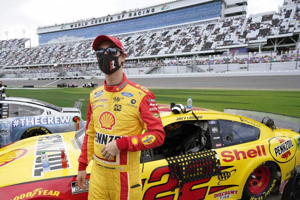 Joey Logano stands by his car on pit road before the start of the NASCAR Daytona 500 auto race at Daytona International Speedway, Sunday, Feb. 14, 2021, in Daytona Beach, Fla. (AP Photo/John Raoux)