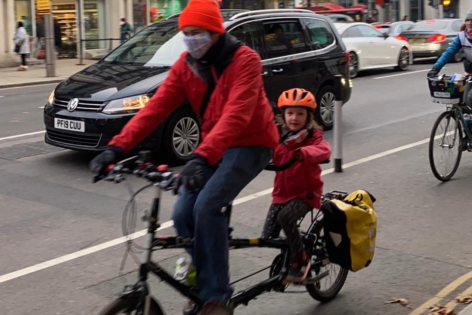 <p>In tandem: adult and child in Kensington High Street </p>Kezia Pearce