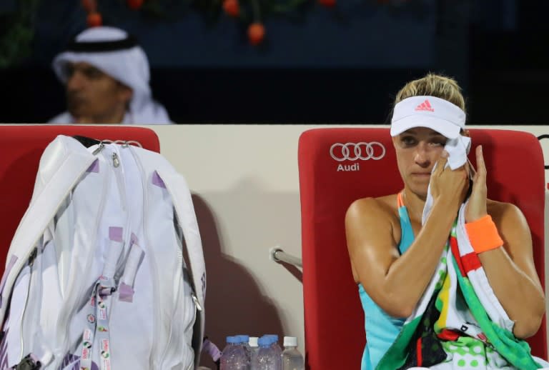 Angelique Kerber of Germany wipes her sweat during her third semi final women's WTA Tennis Championship against Elina Svitolina of Ukraine in Dubai on February 24, 2017