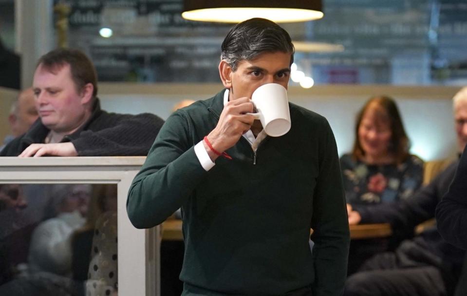 Rishi Sunak, the Prime Minister, is pictured today during a visit to a cafe in Marple near Stockport