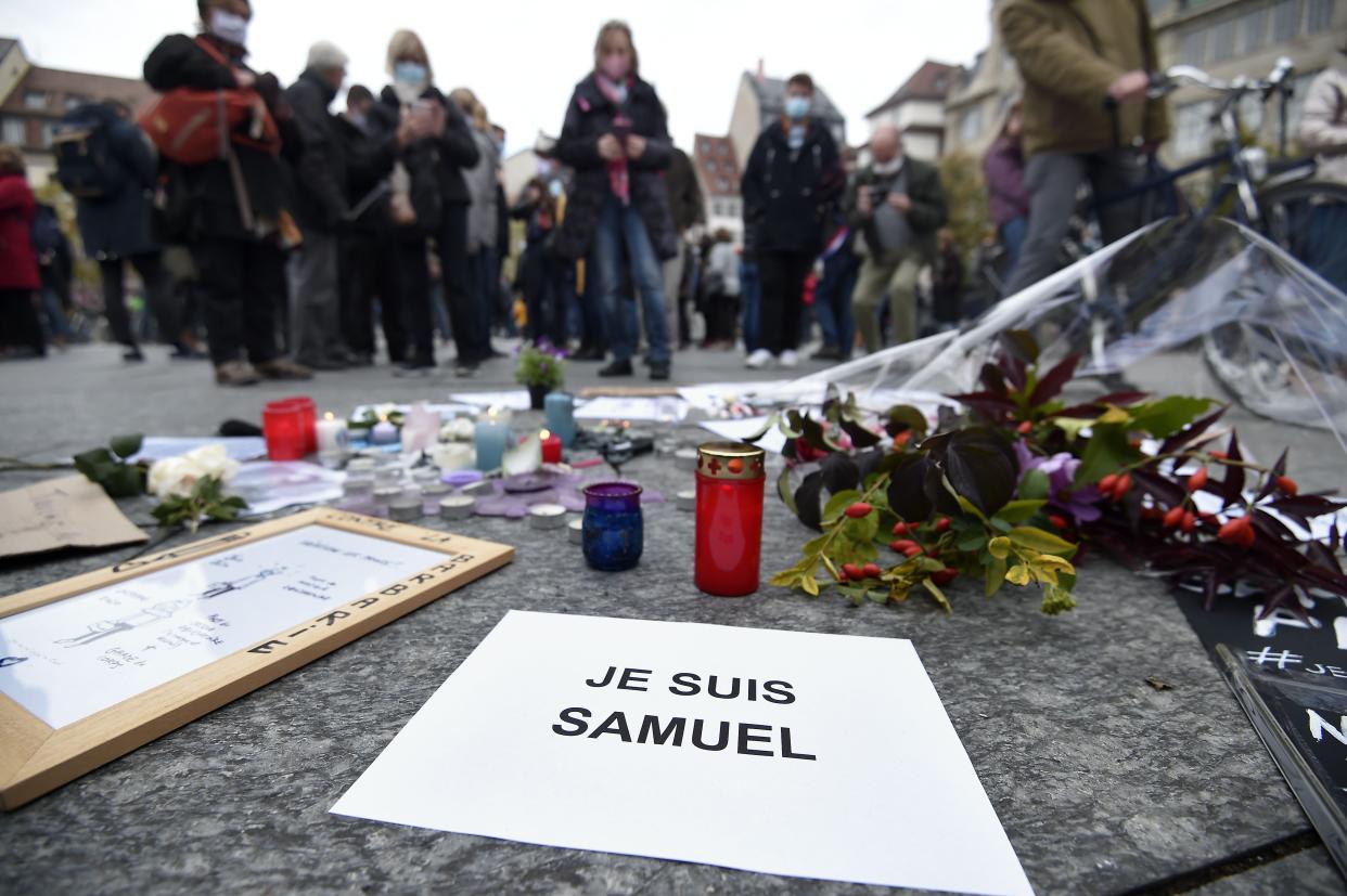 People gathered at the weekend to pay homage to Samuel Paty after he was beheaded outside his school (AFP via Getty Images)