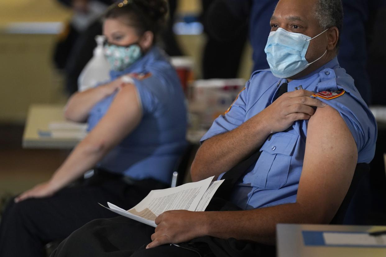 In this Dec. 23, 2020 file photo, New York City firefighter emergency medical services personnel are vaccinated against COVID-19 at the FDNY Fire Academy in New York. An ambitious goal of vaccinating 1 million New York City residents against COVID-19 in January was set Thursday by Mayor Bill de Blasio, who noted that meeting the target would require outside cooperation and the city dramatically increasing access.