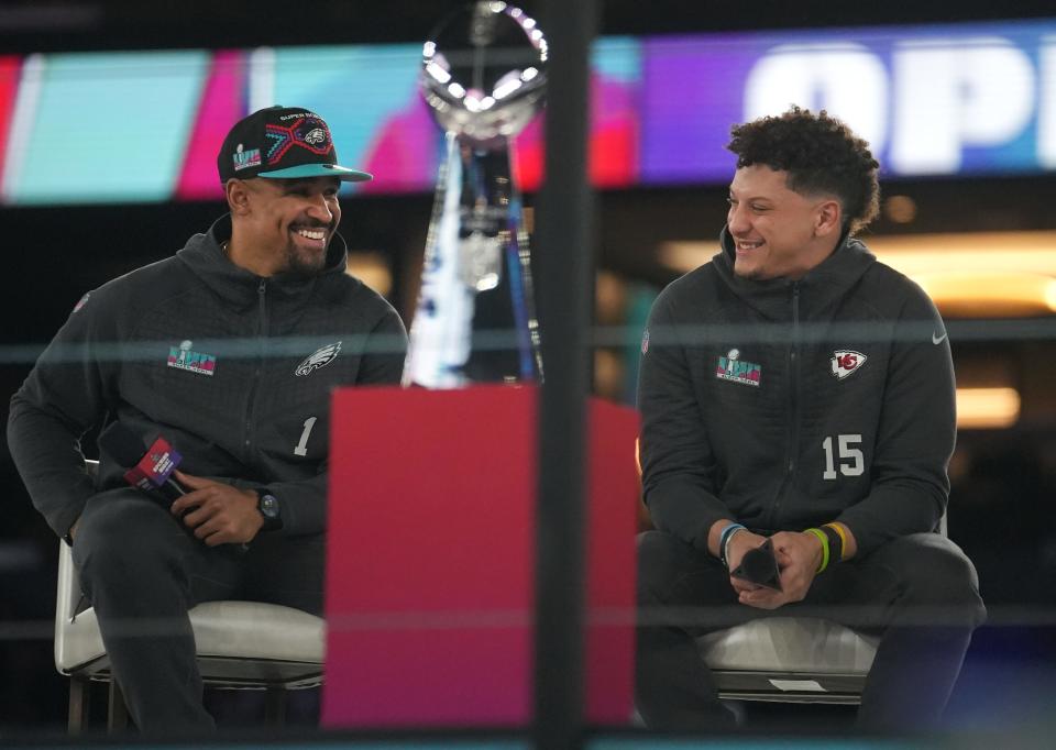 Kansas City Chiefs quarterback Patrick Mahomes, right, and Philadelphia Eagles quarterback Jalen Hurts, left, share the stage during the Super Bowl opening night on Feb. 6, 2023, at Footprint Center in downtown Phoenix.