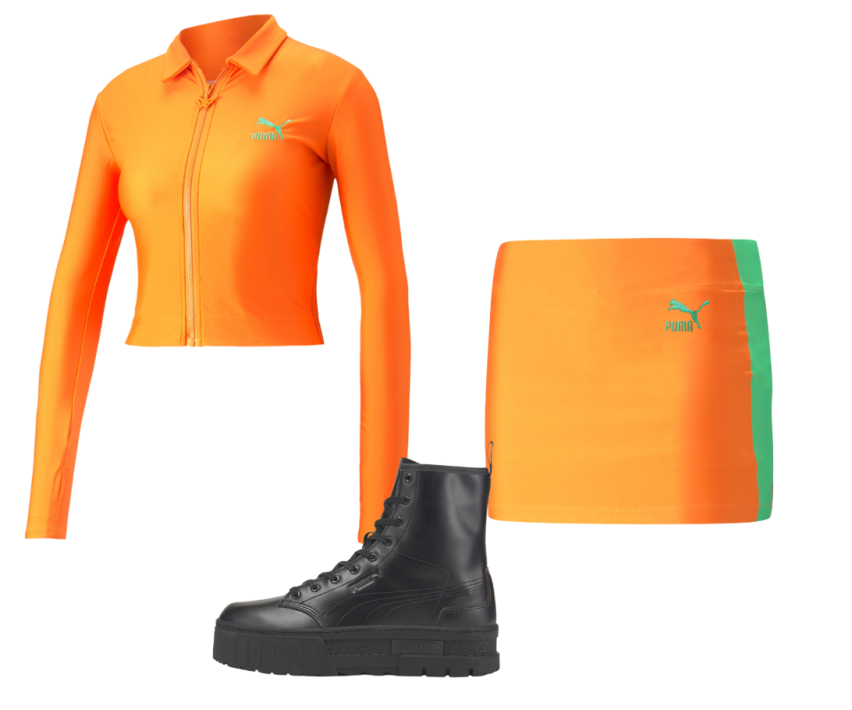 A tight collared long sleeve orange fitness shirt with a matching mini orange skort on its right with high top black lace up leather trainers on the bottom against a white background.