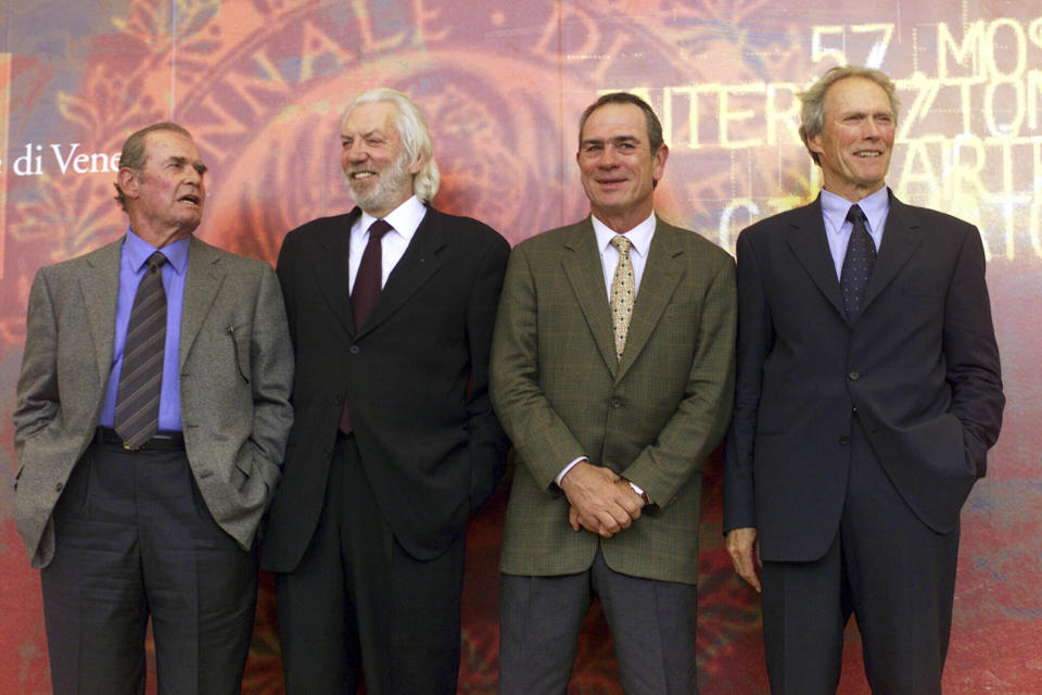 FILE - Actors, from left, James Garner, Donald Sutherland, Tommy Lee Jones and Clint Eastwood, from the film "Space Cowboys," pose for photographers at the Venice Film Festival in Venice, Italy, on Aug. 30, 2000. Sutherland, the towering Canadian actor whose career spanned "M.A.S.H." to "The Hunger Games," has died at 88. (AP Photo/Luca Bruno, File)