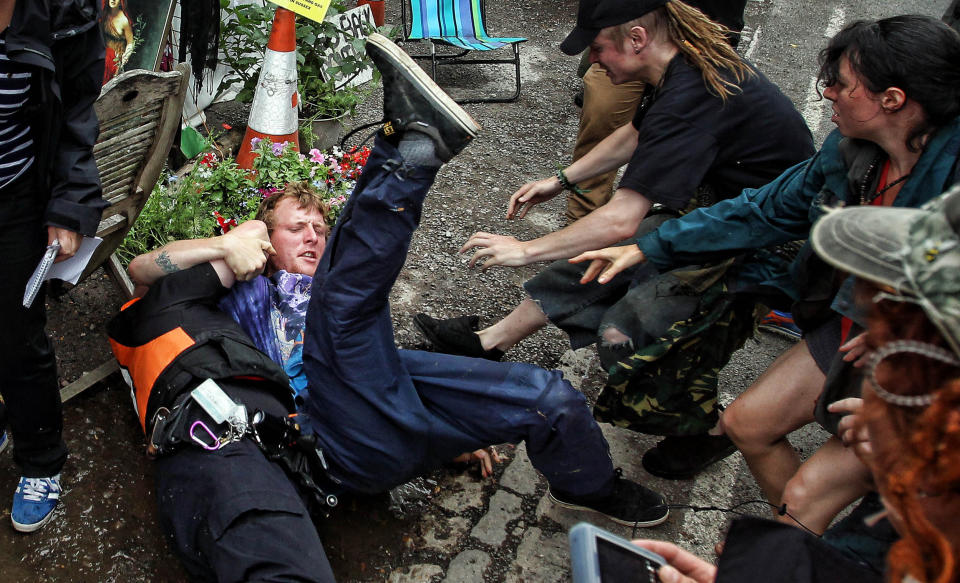 Protesters clash with police at the Balcombe fracking site in West Sussex as energy company Cuadrilla has started testing equipment ahead of exploratory oil drilling in the English countryside as anti-fracking protests at the site entered a ninth day.