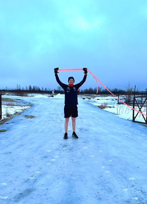 Man holding finishing line in hand 