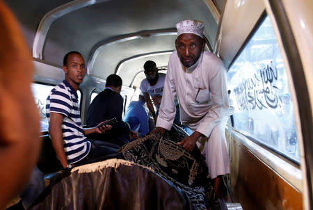 FILE PHOTO: People carry the coffin of Feisal Ahmed Rashid, who was killed in an attack on an upscale hotel compound, at the Chiromo morgue in Nairobi, Kenya January 16, 2019. REUTERS/Thomas Mukoya/File Photo