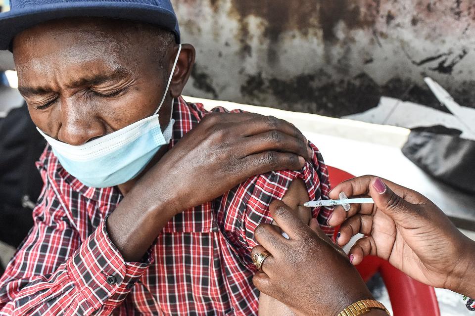 A man is inoculated with a Moderna Covid-19 vaccine in  Nairobi on September 17, 2021. (Photo by Simon MAINA / AFP) (Photo by SIMON MAINA/AFP via Getty Images)