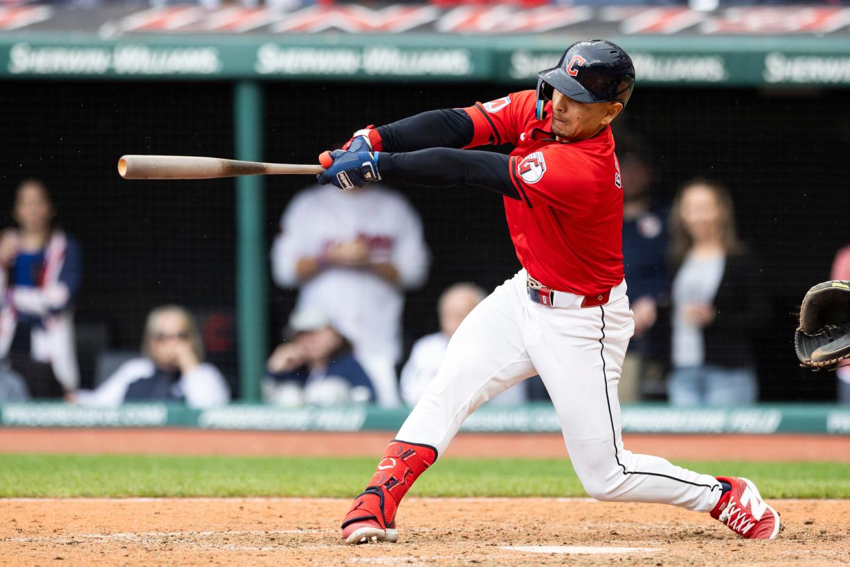 Guardians second baseman Andres Gimenez hits a walk-off sacrifice fly to win the game against the New York Yankees during the 10th inning, April 14, 2024, in Cleveland.