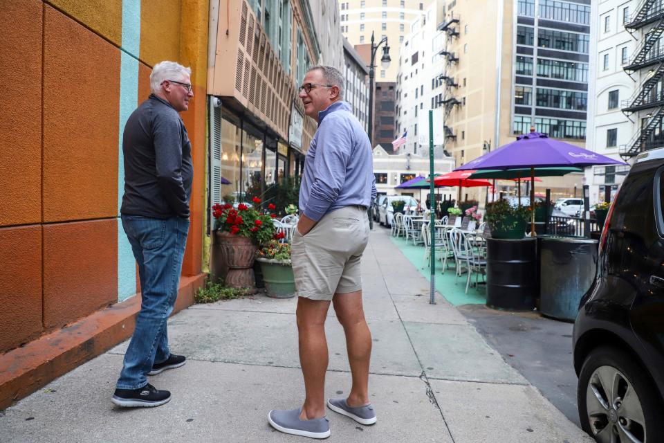 Jeff Komasara (left) and Brian Nottmeier, both of Grosse Pointe, walk to see the Peter Gabriel concert at Little Caesars Arena in downtown Detroit on Sept. 29, 2023.