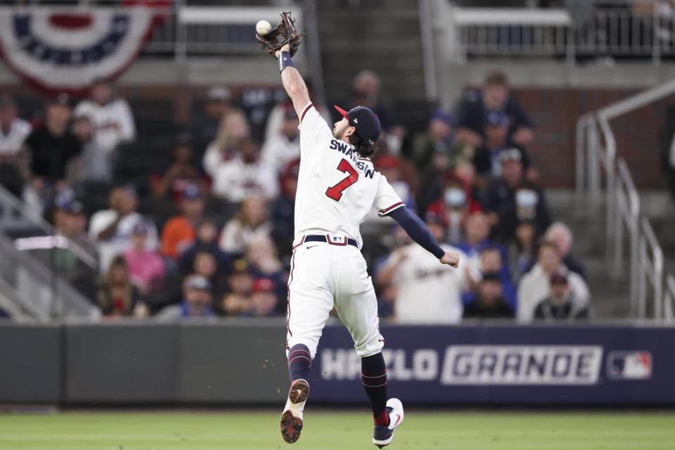 Atlanta Braves shortstop Dansby Swanson fields pop up for an out by Los Angeles Dodgers' Corey Seager