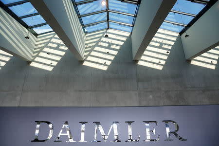 FILE PHOTO: The Daimler logo is seen before the Daimler annual shareholder meeting in Berlin, Germany, April 5, 2018. REUTERS/Hannibal Hanschke