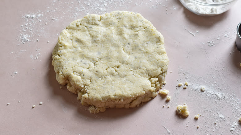 patting scone dough into circle