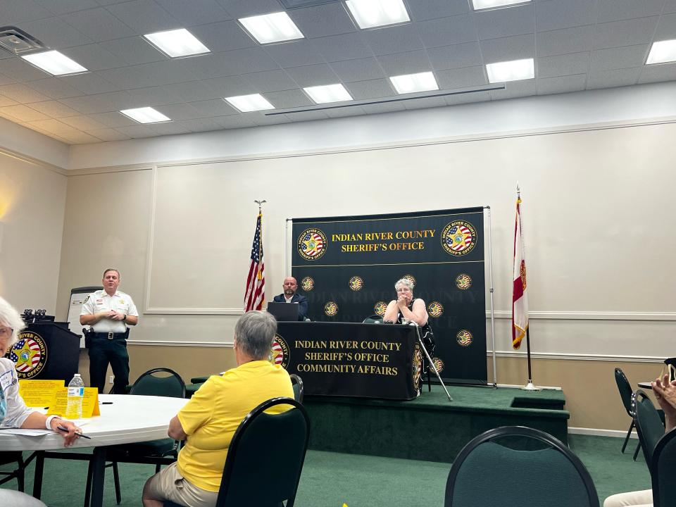 Indian River County Sheriff Eric Flowers (left) speaks to an audience during the American Association of University Women Vero Beach branch panel "Gun violence and the effects on mental health" Saturday, Oct. 21, 2023, at the Indian River County Sheriff's Office in Vero Beach, Fla. The other panelists were Executive Director of Mental Health Collaborative of Indian River County Wes Samons (second from left) and American Association of University Women Vero Beach branch Parliamentarian, Director for Governance Kyp Wasiuk (right).