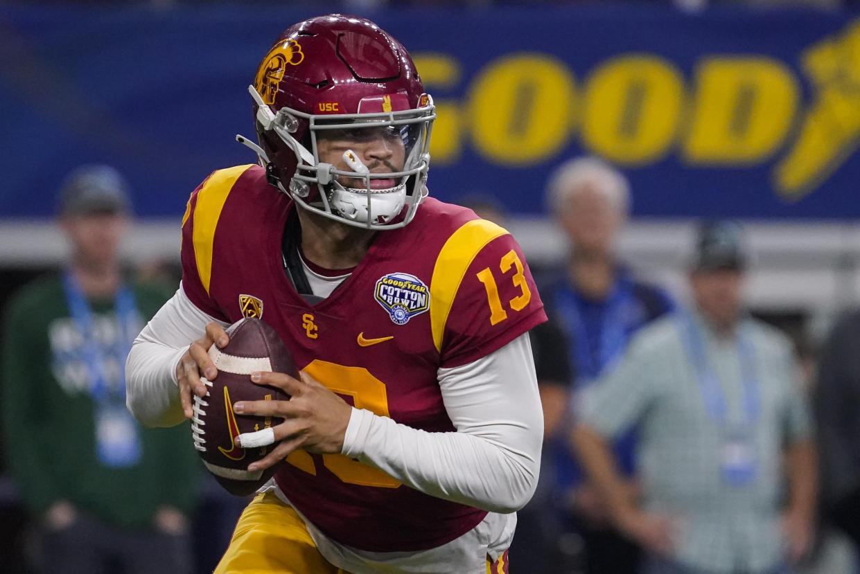 Southern California quarterback Caleb Williams (13) looks to pass during the first half of the Cotton Bowl NCAA college football game against Tulane, Monday, Jan. 2, 2023, in Arlington, Texas. (AP Photo/Sam Hodde)