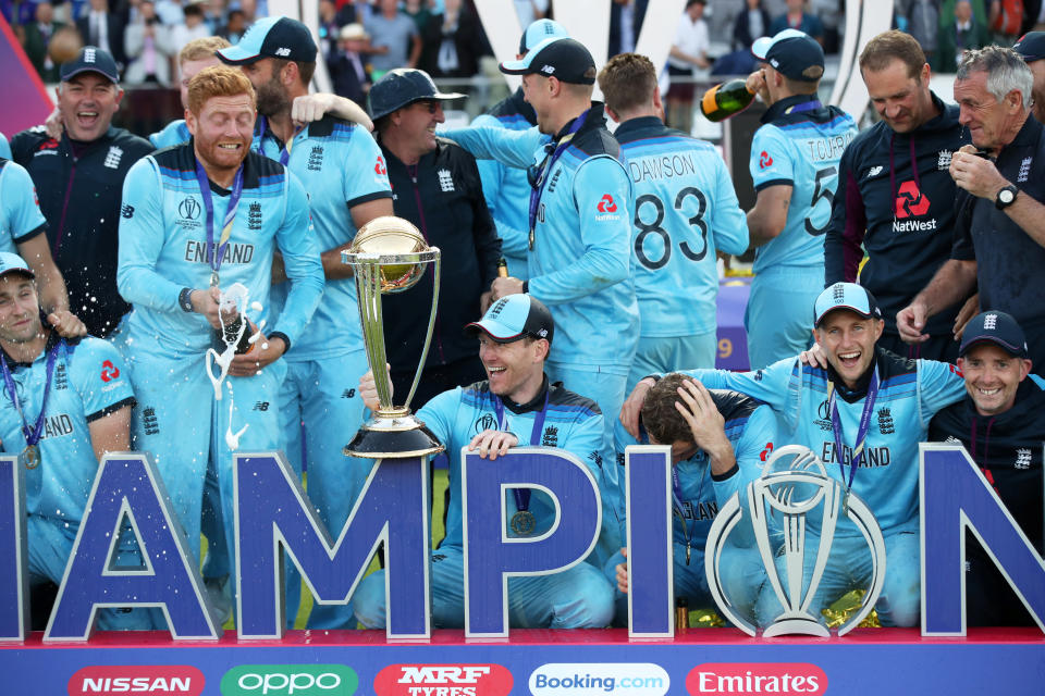 Cricket - ICC Cricket World Cup Final - New Zealand v England - Lord's, London, Britain - July 14, 2019   England's Eoin Morgan and teammates celebrate winning the world cup with the trophy   Action Images via Reuters/Peter Cziborra
