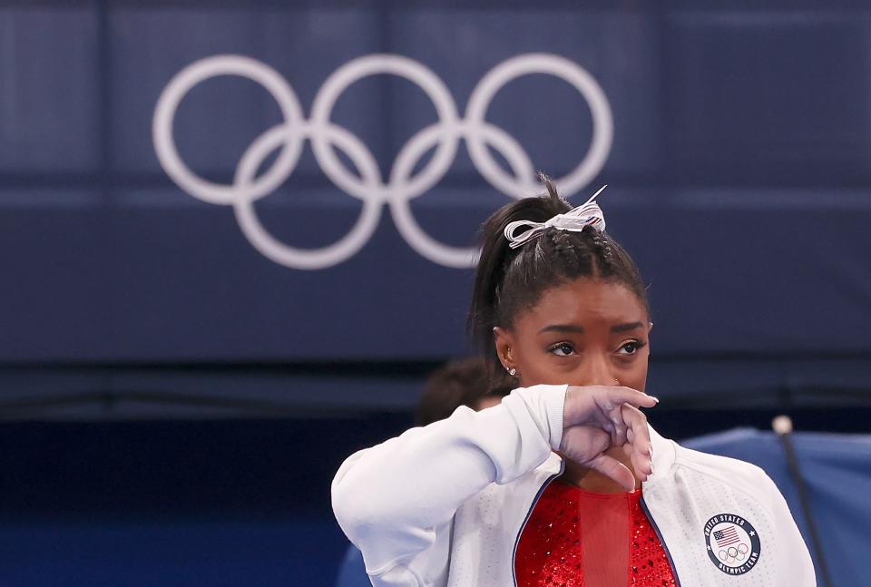 Simone Biles of the United States watches her teammates after withdrawing from the artistic gymnastics women's team final at the Tokyo 2020 Olympic Games in Tokyo, Japan, July 27, 2021. (Photo by Cao Can/Xinhua via Getty Images)