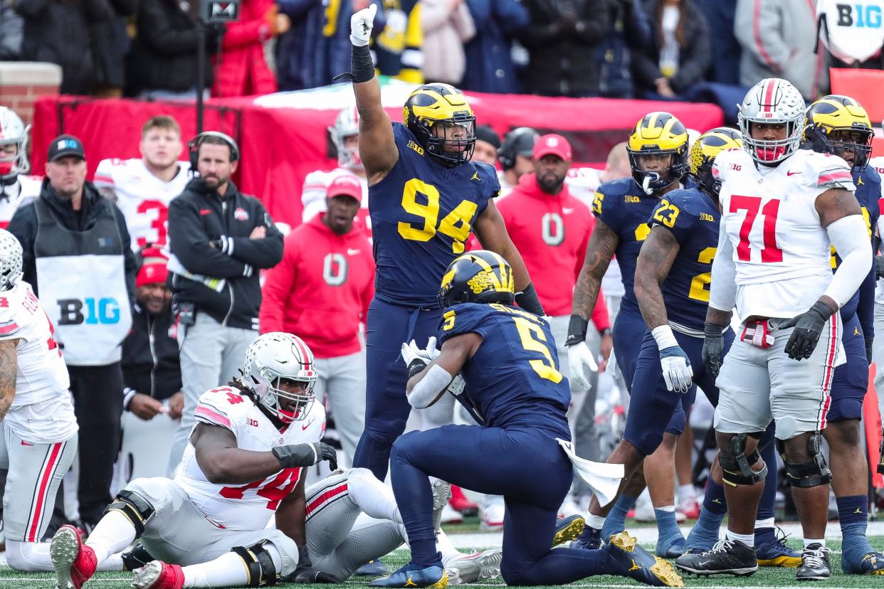 Michigan defensive lineman Kris Jenkins (94) celebrates a tackle against Ohio State during the second half at Michigan Stadium in Ann Arbor on Saturday, Nov. 25, 2023.