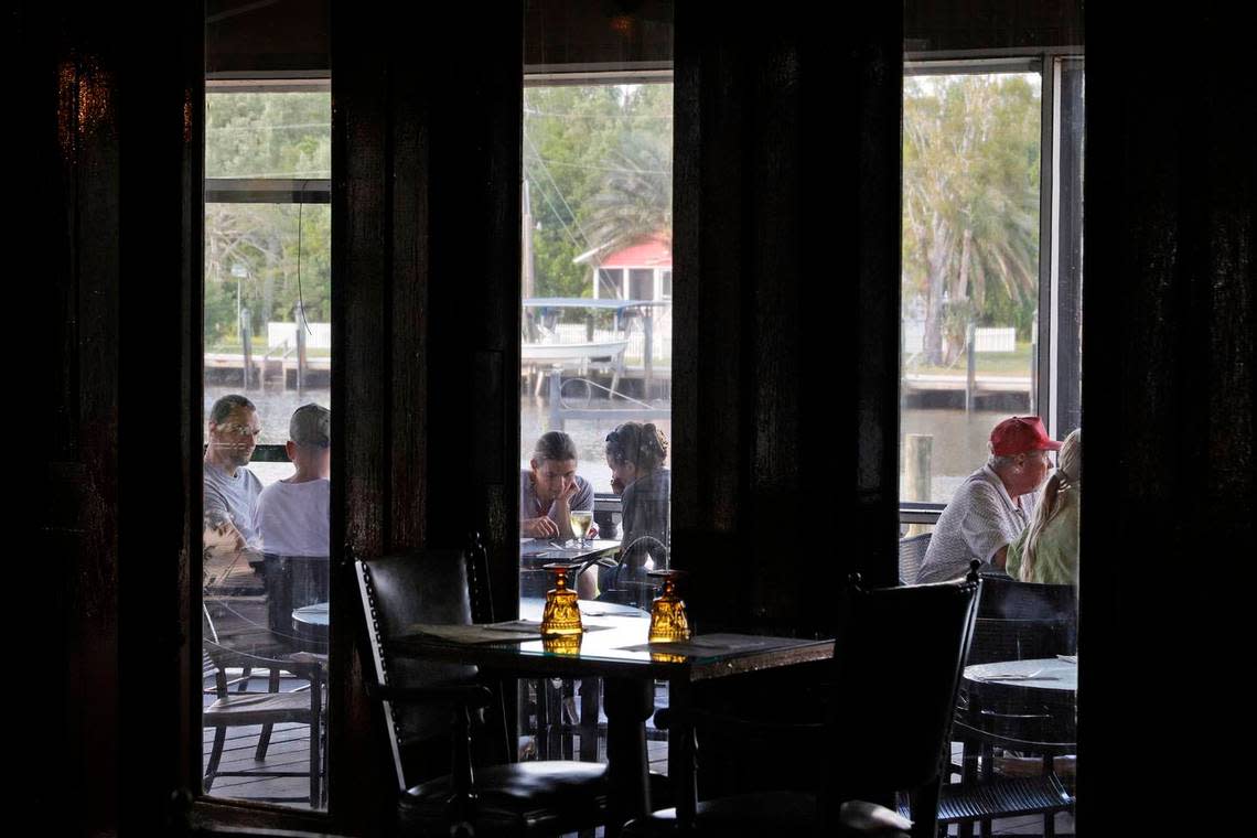 Patrons dine on the patio at the Rod & Gun Club in Everglades City.