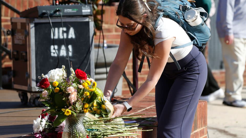 UGA students leave flowers after a vigil for Laken Riley and a UGA freshman who died on campus. - Joshua L. Jones/Online Athens/USA Today Network