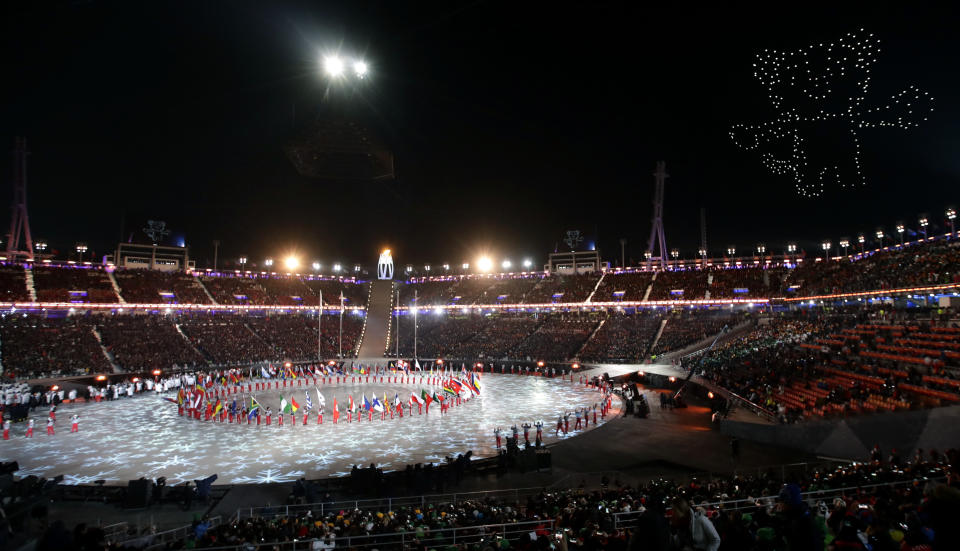 <p>Athletes march into the stadium as an Olympic mascot is illuminated in the sky during the closing ceremony of the 2018 Winter Olympics in Pyeongchang, South Korea, Sunday, Feb. 25, 2018. (AP Photo/Chris Carlson) </p>