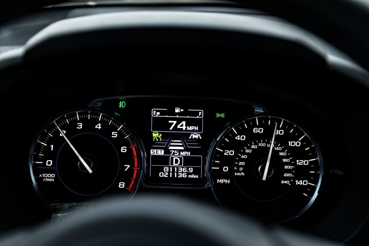 speeding car dashboard speedometer display close up