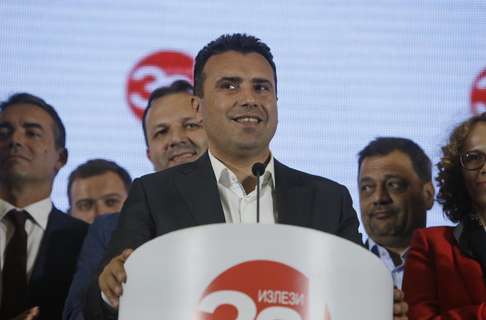 Macedonia's Prime Minister Zoran Zaev talks to members of the media during a news conference about the referendum in Skopje, Macedonia, late Sunday, Sept. 30, 2018. Zaev has described the crucial referendum on changing the small European country's name to North Macedonia and thereby pave the way to NATO membership as a clear success, despite lower than hoped for voter turnout. Zaev said he had no intention of resigning as the "vast majority" of those who voted Sunday approved the name change. (AP Photo/Boris Grdanoski)