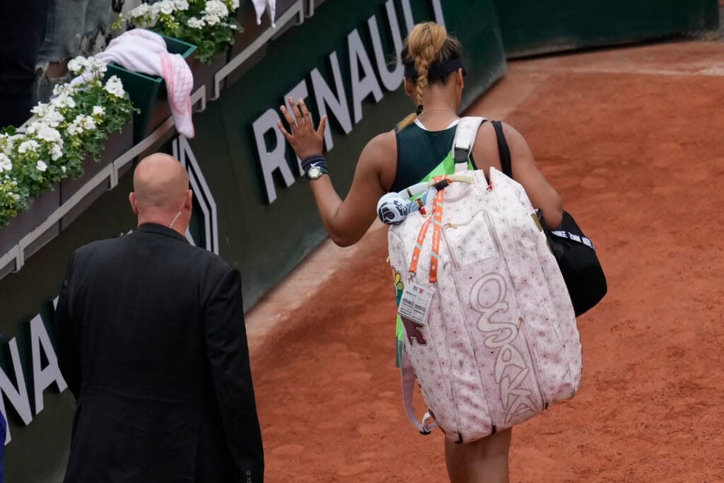 Japan’s Naomi Osaka leaves after losing against Amanda Anisimova of the U.S. during their first round match at the French Open tennis tournament in Roland Garros stadium in Paris, France, Monday, May 23, 2022. (AP Photo/Christophe Ena)