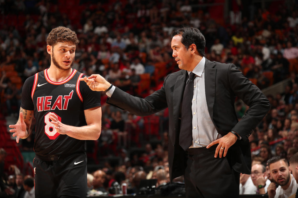 Heat coach Erik Spoelstra talks with guard Tyler Johnson, who has a four-year, $50 million contract. (Getty)