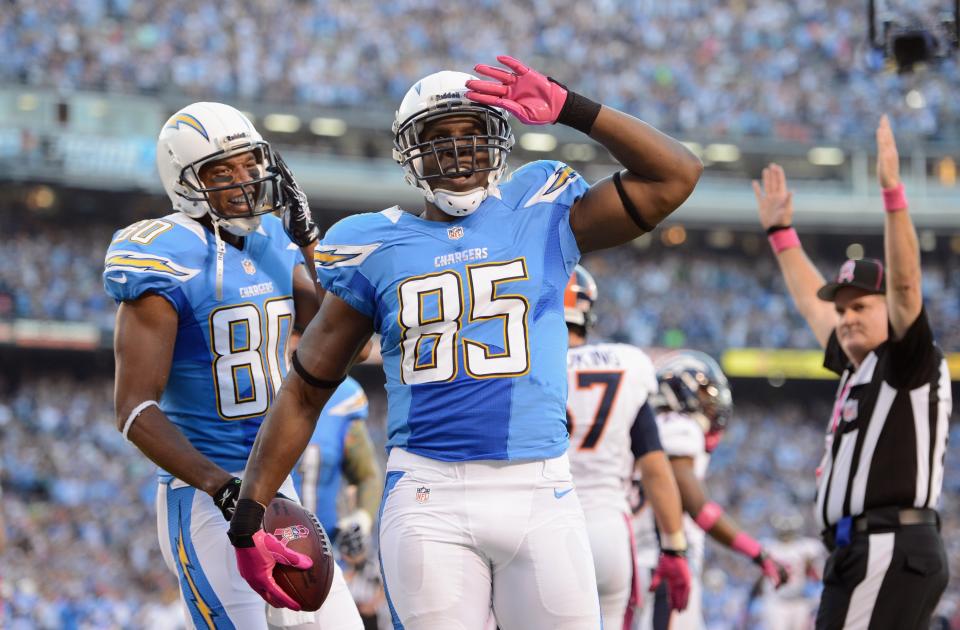 SAN DIEGO, CA - OCTOBER 15: Antonio Gates #85 of the San Diego Chargers celebrates his first quarter touchdown against the Denver Broncos as teammate Malcom Floyd #80 looks on during the NFL game at Qualcomm Stadium on October 15, 2012 in San Diego, California. (Photo by Harry How/Getty Images)